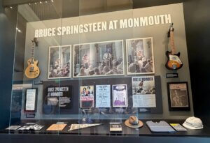 Display case of items connecting Bruce Springsteen to Monmouth University