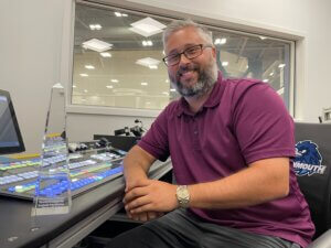 Man sitting at control booth