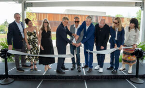 A group of people at a ribbon cutting ceremony