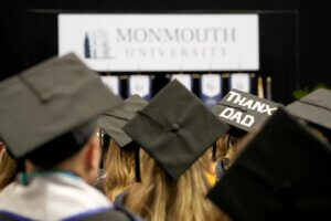 Graduation caps, seen from the rear, at a Commencement ceremony