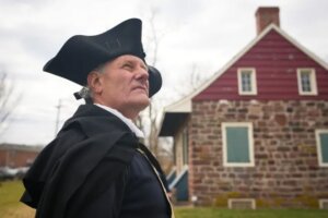 John Koopman, an reenactor playing Gen. George Washington, looks on during a Revolutionary War reenactment at New Bridge Landing in River Edge on Nov. 23, 2025. River Edge, NJ, USA. Yannick Peterhans/NorthJersey.com