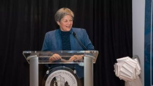 Former Monmouth Vice President and Director of Athletics Dr. Marilyn McNeil presenting at a podium