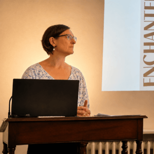 Professor Kristin Bluemel delivering a presentation