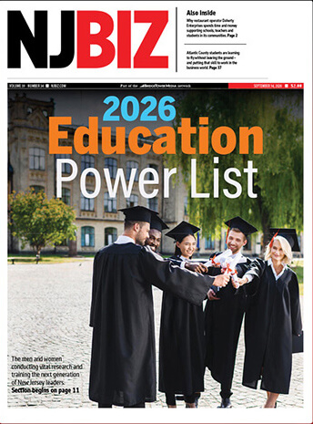 Cover of NJ Biz magazine, featuring the 2026 Education Power List. The cover features a group of men and women in academic robes and caps standing in a unversity setting, while holding diplomas. This image is also hyperlinked to an outside link, the NJ Biz issue .