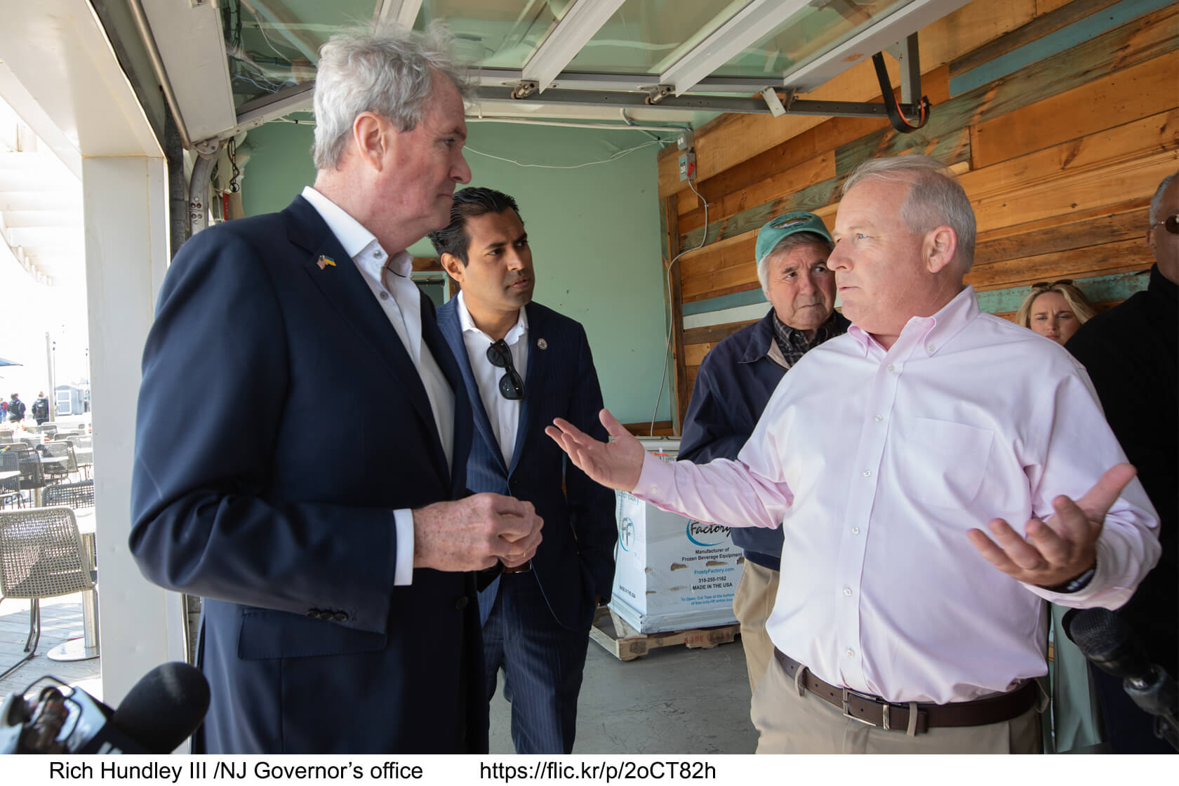 Image of Phil Murphy speaking with a business owner.