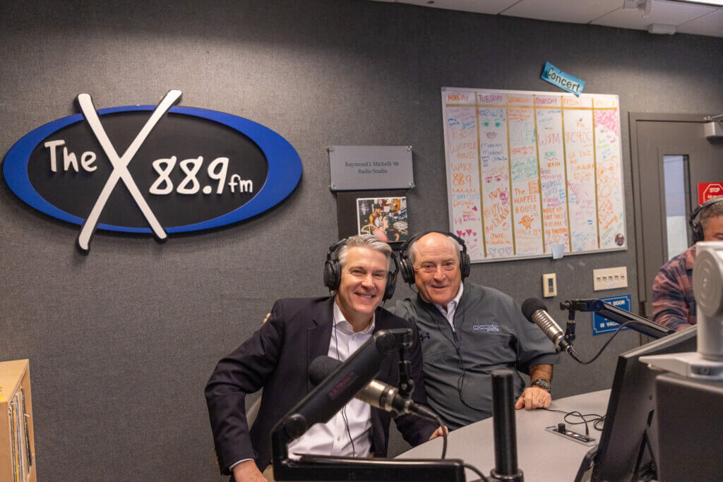 President Patrick F. Leahy and Head Coach Kevin Callahan in the broadcast studios of WMCX