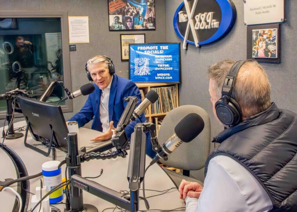 President Patrick F. Leahy and Prof. Matt Harmon in WMCX broadcast booth