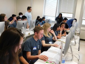 Room full of male and female students at the competition