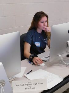 1 female student from Red Bank Regional High School focused and working on her computer