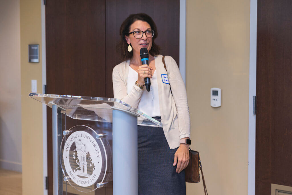 Professional speaking at a podium