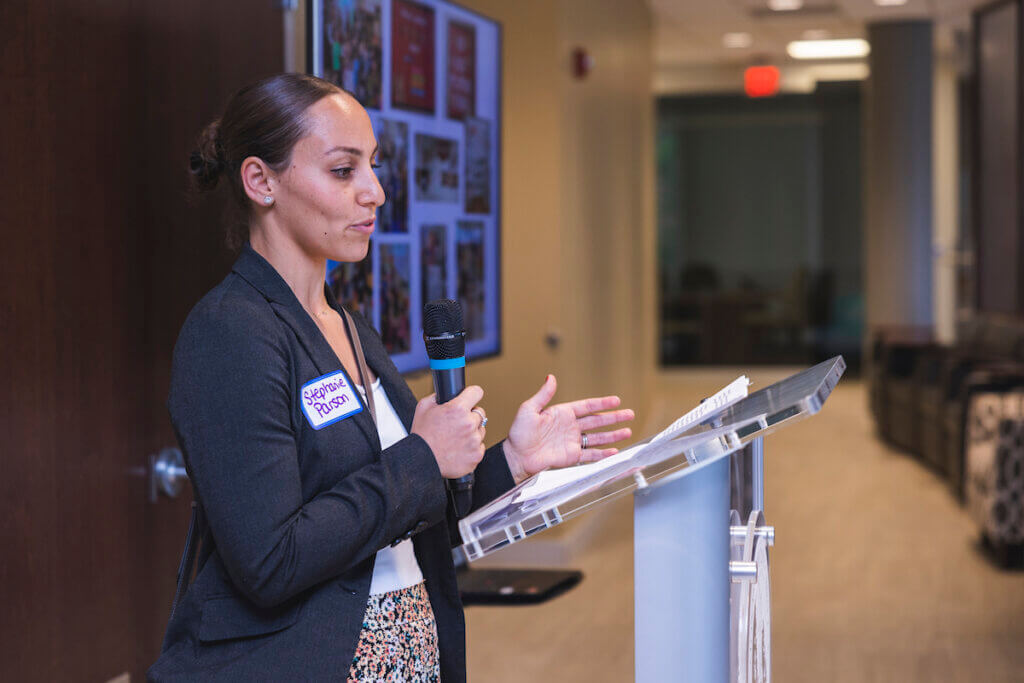 Professional speaking at a podium