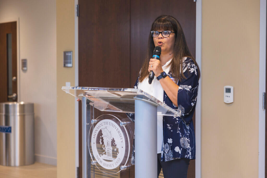 Professional speaking at a podium