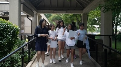 Camp participants walking and talking among themselves