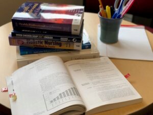 An open book on a desk with study materials.