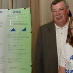 Click to View 2013 Summer Research Symposium Photo of Rebecca Porskievies and her father