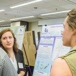 Click to view 2016 Student Research Conference Photo of Kelsey Sparta discusses her research