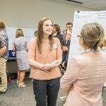 Click to view 2016 Student Research Conference Photo of Brittany Reed presents her research