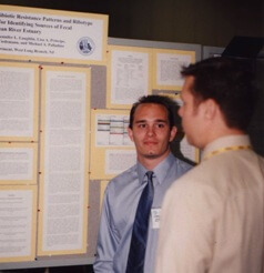 Photo of Lawrence Perruzza presenting his research at the American Society for Microbiology, 2001.