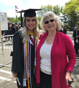 Photo of Taylor Campos and CSSE Chair Jamie Kretsch on graduation day.