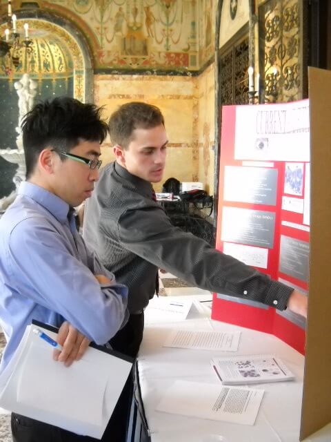 Photo of Justin Hanenberg presenting his research to Dr. Pang at the Student Research Conference 2010