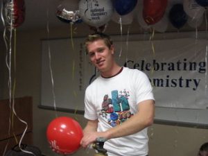 Photo of Robert Powoski in 2006 raising awareness of National Chemistry Week with the Chemistry Club.