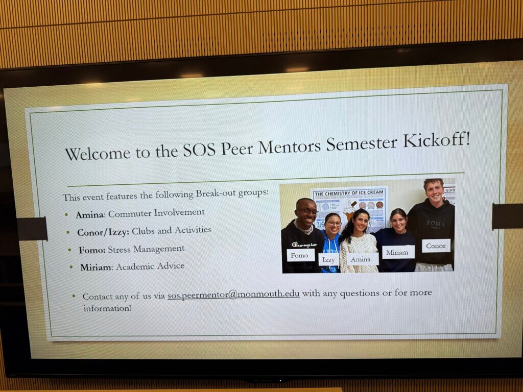 A poster on the TV, showing Welcome to SOS peer mentor kickoff event. This poster lists the peer mentors' name and the breakout groups they will host, along with a photo of five peer mentors.