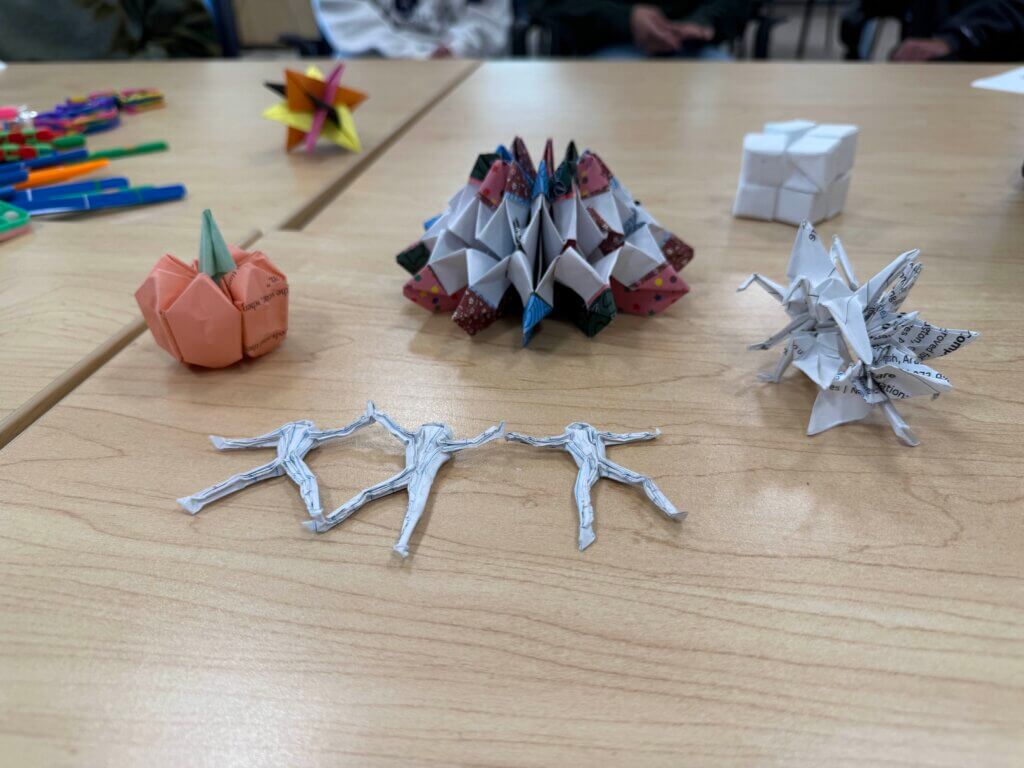 Some paper origami on a desk.