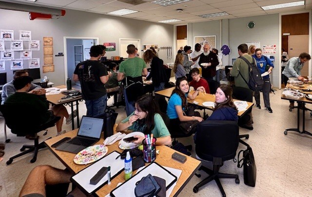 Students and professors enjoying baked goods