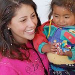 Photo of MU student and youngster in Guatemala - Click to view larger image