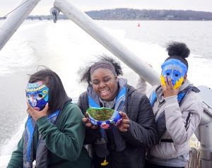 Photo of three students enjoying their face masks