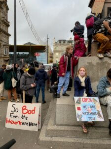 Photo of protestors with signs at COP26