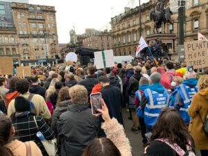 Photo shows large group taking part in a march in Glasgow.