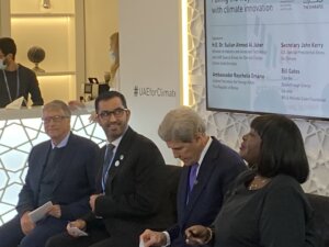 Photo shows Bill Gates (pictured far left) and Secretary of State John Kerry (pictured second from right) as they prepare for a panel discussion.
