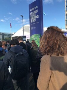 Photo shows lines of people waiting to enter the COP26 conference