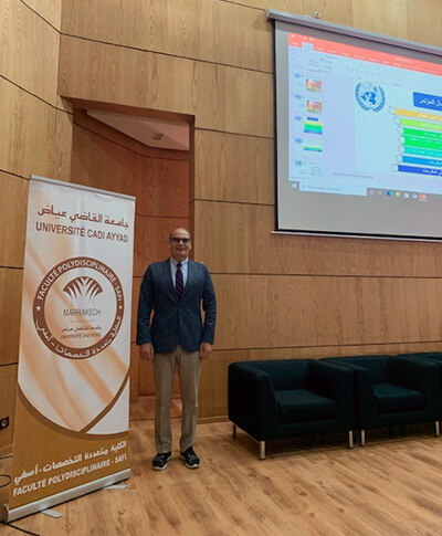 Abate stands in front of lecture hall in Safi during the two-day Ocean Science Forum