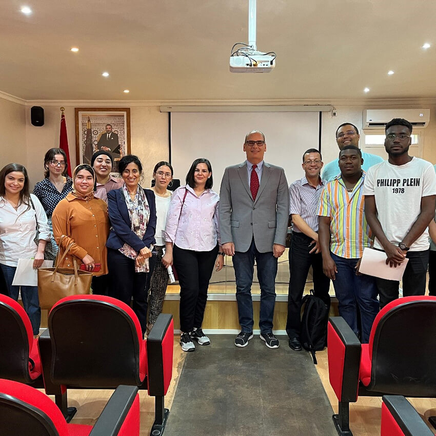 Randall Abate (center) with audience members atttending his lecture at Cadi Ayyad University in Marrakesh