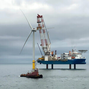A wind turbine being constructed in the ocean