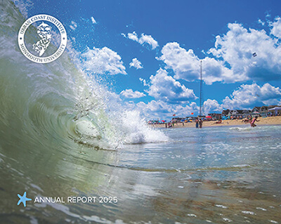 The front cover of the UCI's 2025 annual report, featuring an image of a wave breaking on a sunny beach