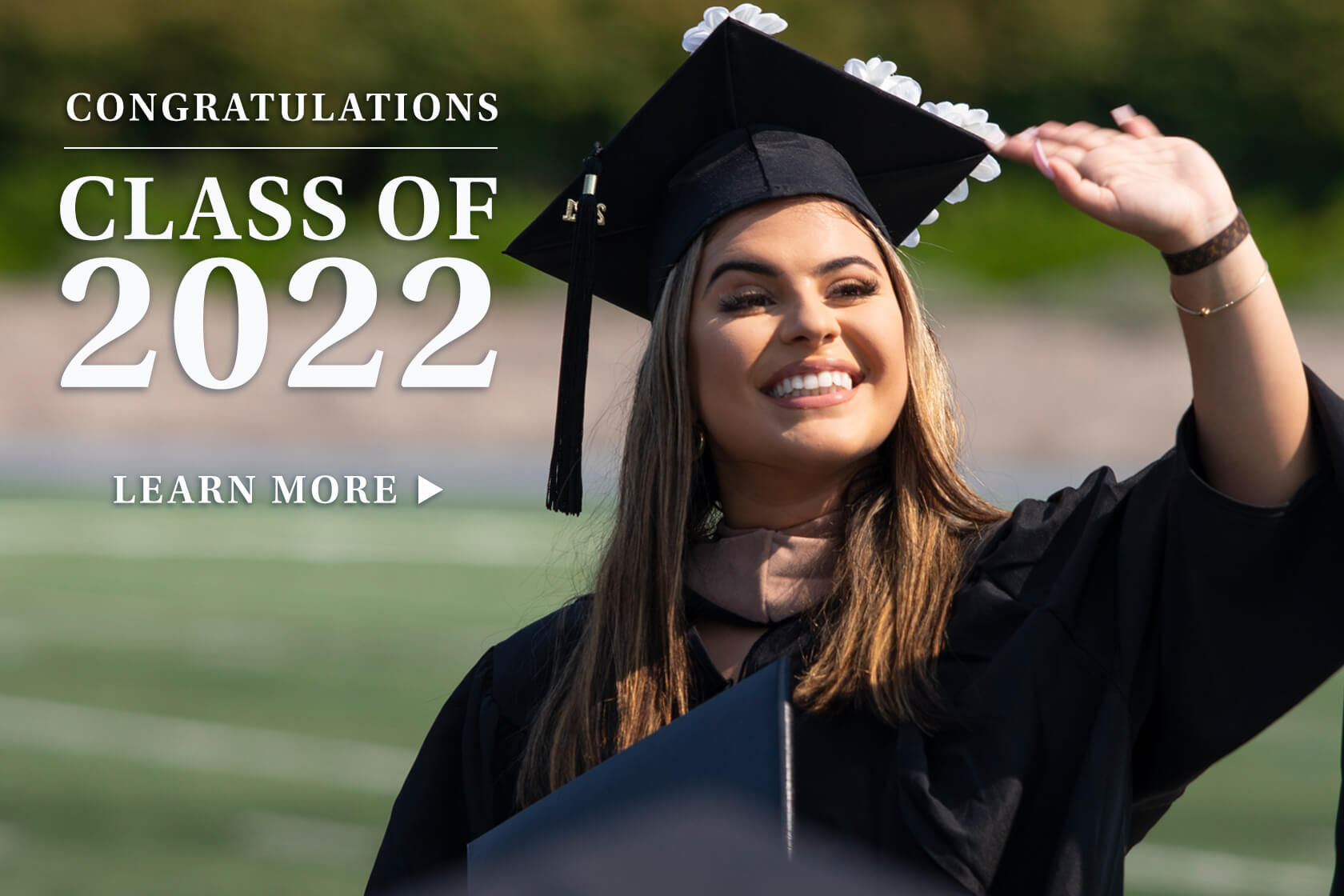 A women in a graduation cap and gown with the following text next to her Congratulations Class fo 2022, learn more.