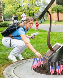 Remembering 9/11. 🇺🇸 #MonmouthU unites in a tribute at our 9/11 Memorial, planting flags to honor heroes and remember those we lost.

This Memorial, which houses a piece of steel from the World Trade Center, was generously gifted by Lewis & Judith Eisenberg in 2011.🗽 #NeverForget