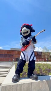 One glimpse into the past. One legend. One very inspired Hawk. 🎸Happy National Rock and Roll Day from our very own Bruce Shadow-steen. 💙🤘 #MonmouthU